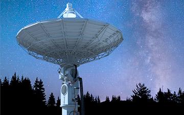 Space technology demonstrated through a large ground station pointed at the night sky